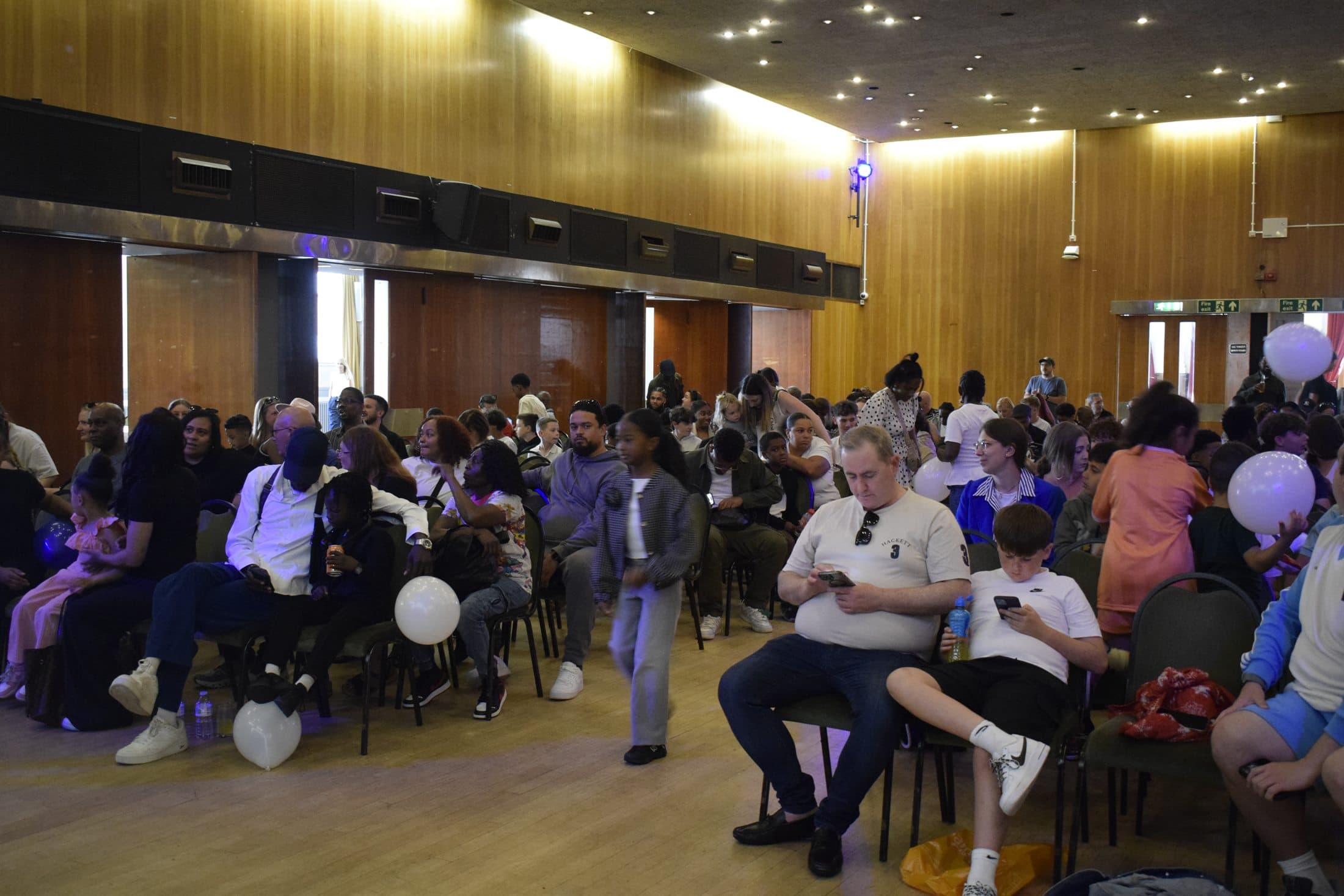 Families and young people gathered at a community event
