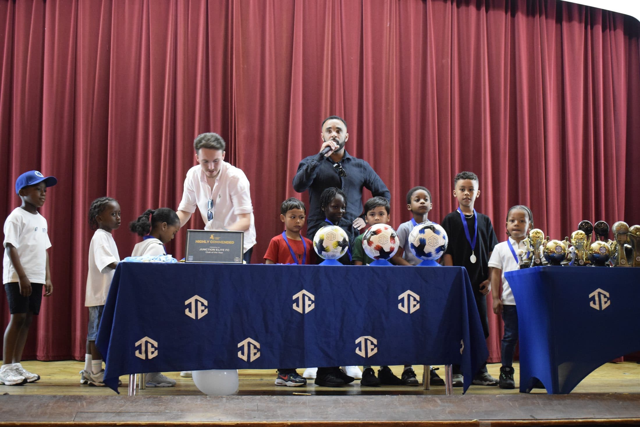 Young people being recognised on stage