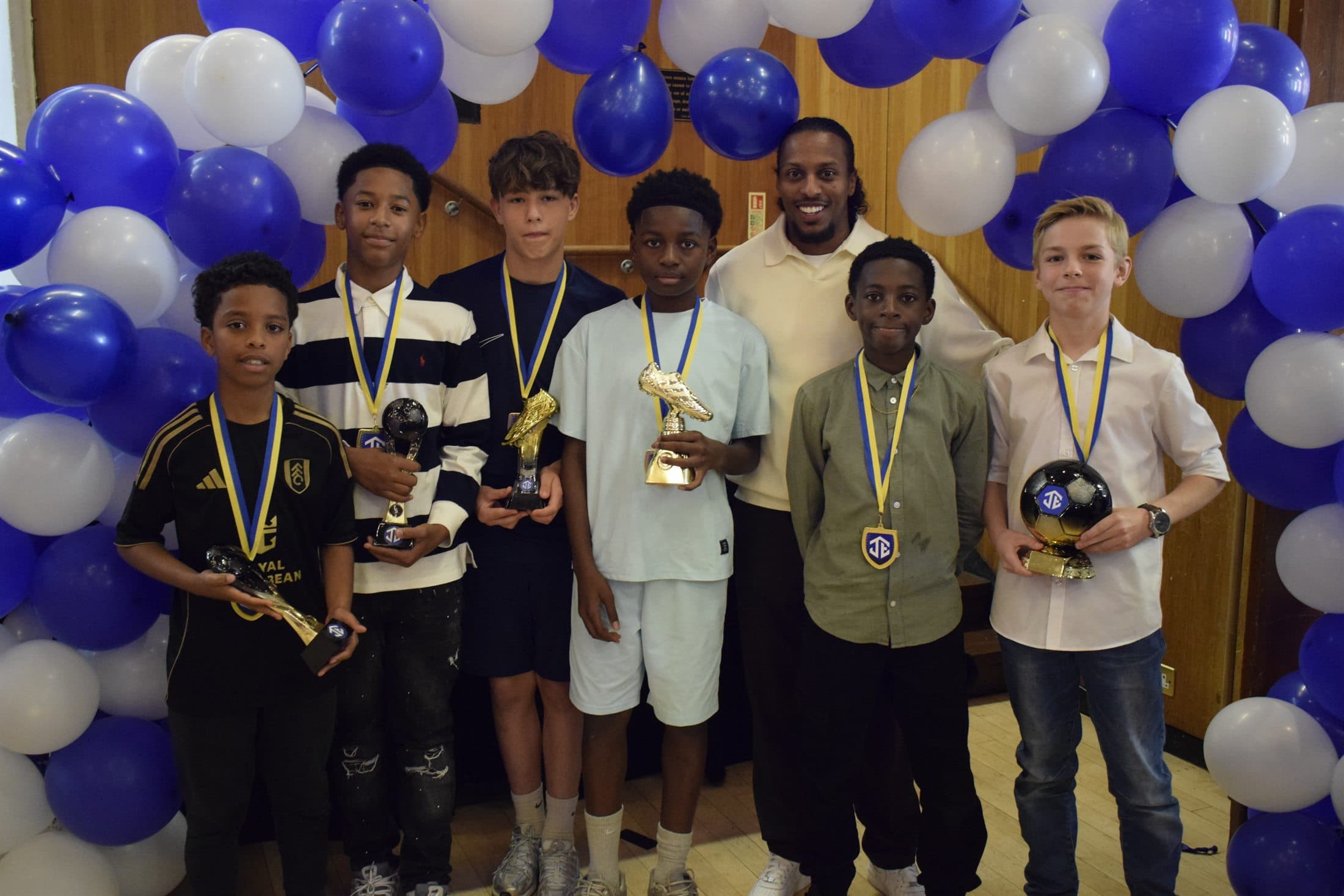 Junction Elite award winners with trophies