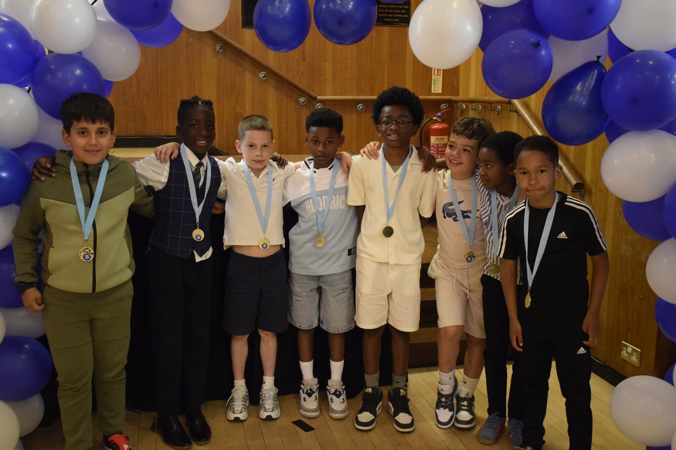 Young players with medals at awards night