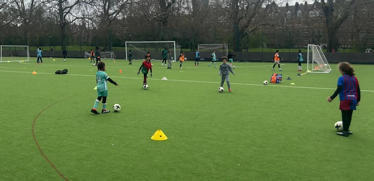 Young people taking part in football activity